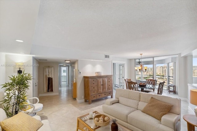 100 Golden Isles Dr Unit 1105, Hallandale Beach, FL 33009 - living room with a chandelier, light tile patterned floors, and baseboards