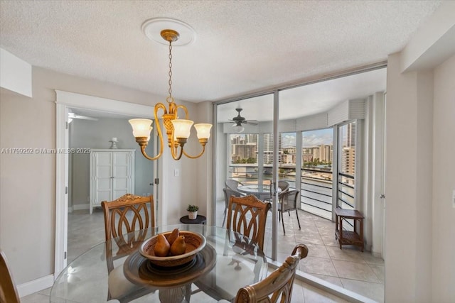 100 Golden Isles Dr Unit 1105, Hallandale Beach, FL 33009 - dining area with a textured ceiling, baseboards, light tile patterned flooring, a chandelier, and ceiling fan