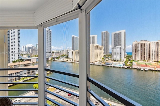 100 Golden Isles Dr Unit 1105, Hallandale Beach, FL 33009 - unfurnished sunroom with a water view and a skyline view