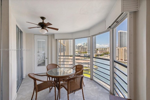 100 Golden Isles Dr Unit 1105, Hallandale Beach, FL 33009 - sunroom with a water view, a view of city, and tile patterned floors