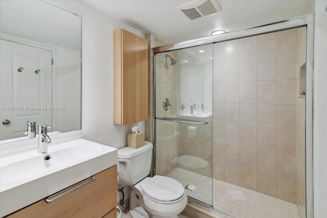 100 Golden Isles Dr Unit 1105, Hallandale Beach, FL 33009 - bathroom featuring a stall shower, toilet, and vanity