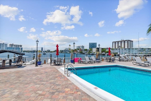 100 Golden Isles Dr Unit 1105, Hallandale Beach, FL 33009 - community pool featuring a water view and a patio area