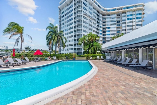 100 Golden Isles Dr Unit 1105, Hallandale Beach, FL 33009 - community pool with a patio area