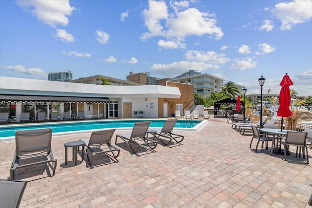 100 Golden Isles Dr Unit 1105, Hallandale Beach, FL 33009 - community pool with a patio