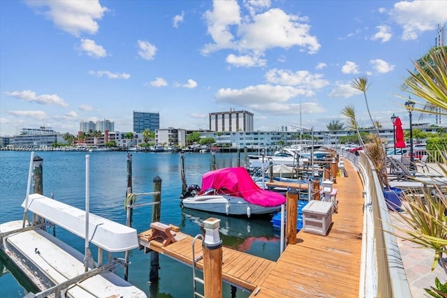 100 Golden Isles Dr Unit 1105, Hallandale Beach, FL 33009 - dock with a water view, boat lift, and a view of city