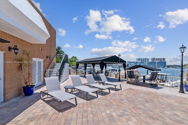100 Golden Isles Dr Unit 1105, Hallandale Beach, FL 33009 - view of patio featuring a gazebo and stairs