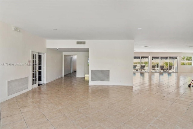 100 Golden Isles Dr Unit 1105, Hallandale Beach, FL 33009 - spare room with baseboards and light tile patterned floors