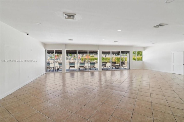 100 Golden Isles Dr Unit 1105, Hallandale Beach, FL 33009 - tiled spare room with baseboards and recessed lighting