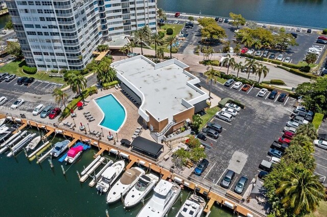 100 Golden Isles Dr Unit 1105, Hallandale Beach, FL 33009 - bird's eye view of a pool, apartment complex / building, and a nearby body of water