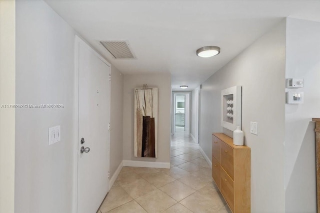 100 Golden Isles Dr Unit 1105, Hallandale Beach, FL 33009 - hall with light tile patterned floors and baseboards