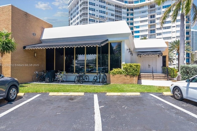 100 Golden Isles Dr Unit 1105, Hallandale Beach, FL 33009 - view of uncovered parking lot