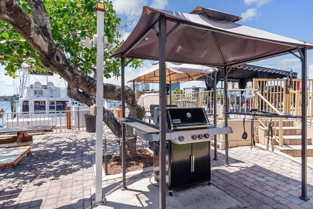 100 Golden Isles Dr Unit 1105, Hallandale Beach, FL 33009 - view of patio / terrace with grilling area