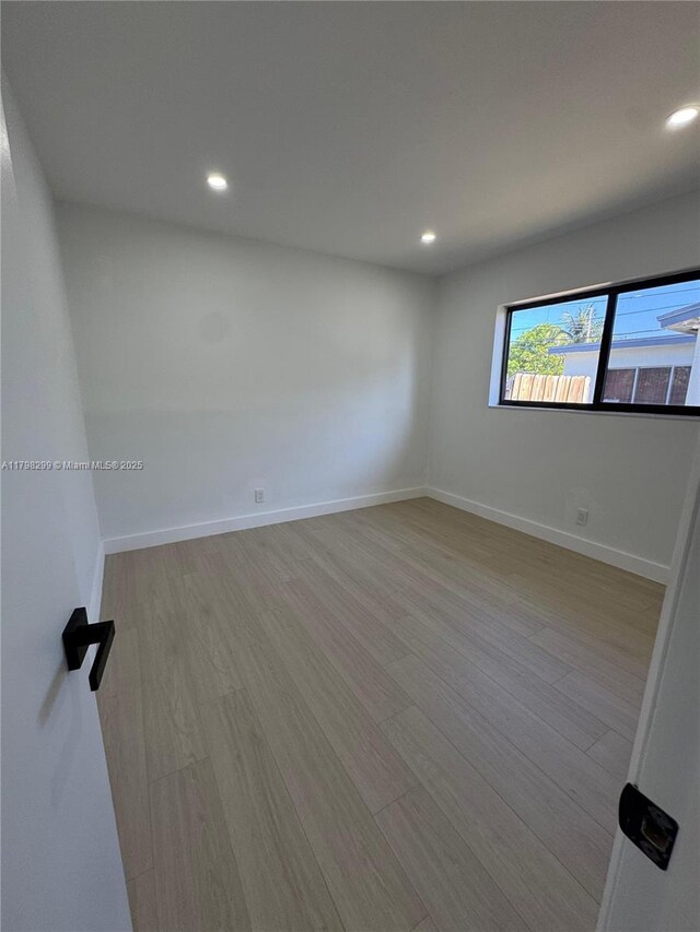 421 SW 11th Ave, Hallandale Beach, FL 33009 - unfurnished room featuring wood finished floors, recessed lighting, and baseboards