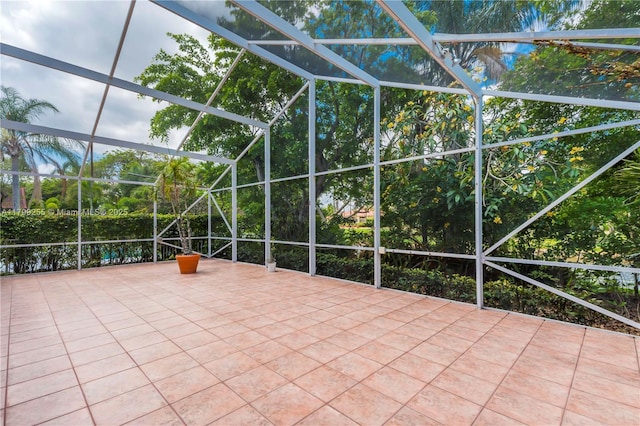 view of patio / terrace featuring a lanai
