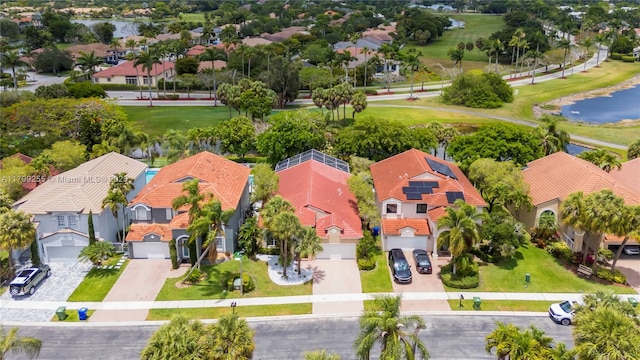 aerial perspective of suburban area with a large body of water and a golf club