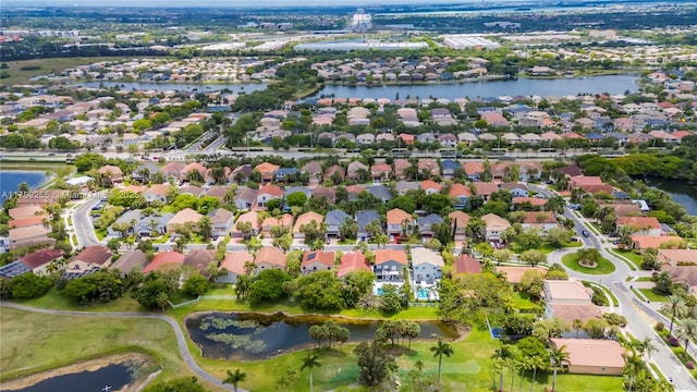view of property location with nearby suburban area and a nearby body of water