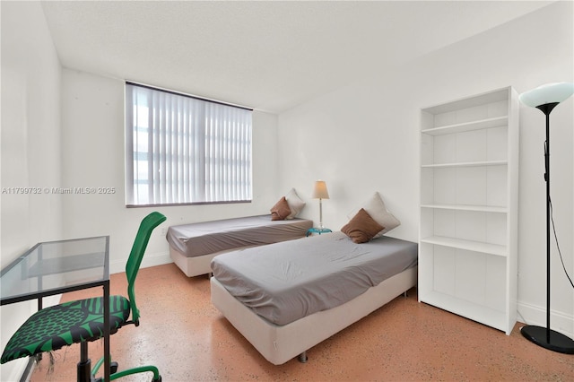 2750 NE 183rd St Unit 504, Aventura, FL 33160 - bedroom with speckled floor and baseboards