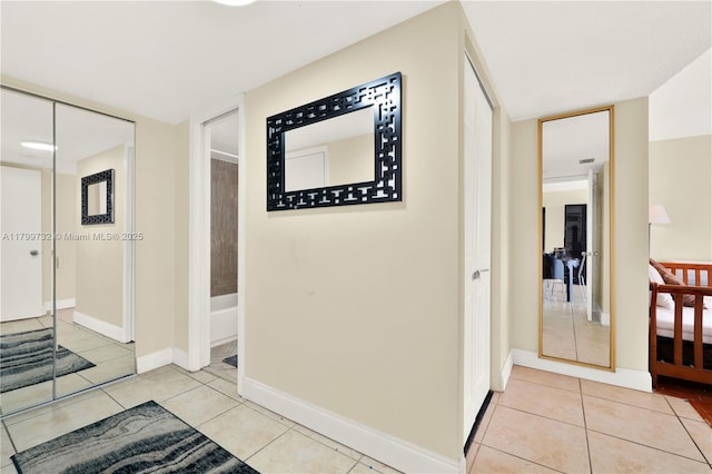 2750 NE 183rd St Unit 504, Aventura, FL 33160 - hall with light tile patterned floors and baseboards