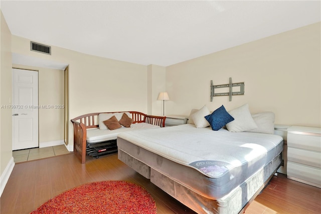 2750 NE 183rd St Unit 504, Aventura, FL 33160 - bedroom featuring wood finished floors and baseboards