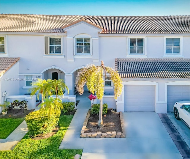 16818 SW 1st Mnr, Pembroke Pines, FL 33027 - mediterranean / spanish-style home featuring a tile roof, stucco siding, an attached garage, and concrete driveway
