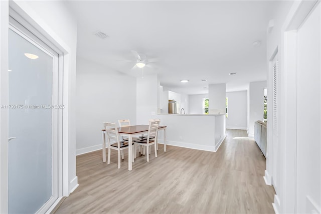 16818 SW 1st Mnr, Pembroke Pines, FL 33027 - dining room featuring light wood-type flooring, ceiling fan, and baseboards