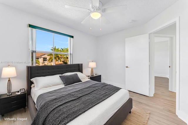 16818 SW 1st Mnr, Pembroke Pines, FL 33027 - bedroom featuring light wood finished floors, a ceiling fan, and baseboards