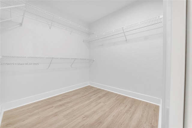 16818 SW 1st Mnr, Pembroke Pines, FL 33027 - spacious closet featuring wood finished floors