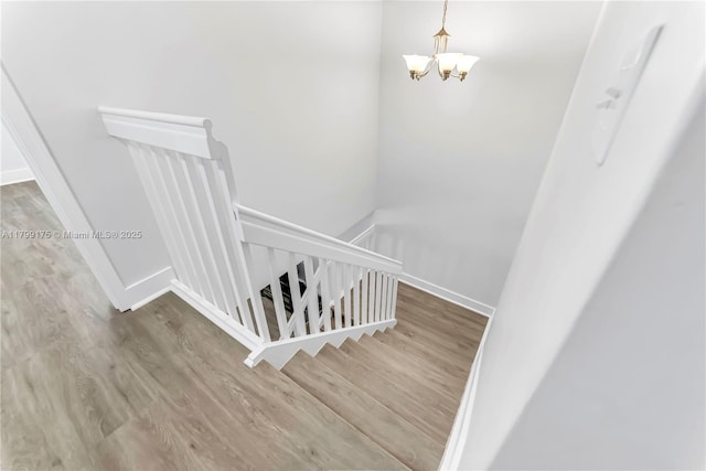 16818 SW 1st Mnr, Pembroke Pines, FL 33027 - staircase with wood finished floors, a chandelier, and baseboards