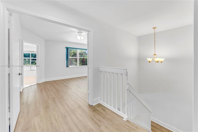 16818 SW 1st Mnr, Pembroke Pines, FL 33027 - hall featuring an upstairs landing, a chandelier, light wood-style flooring, and baseboards