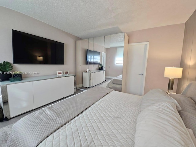 bedroom featuring a textured ceiling
