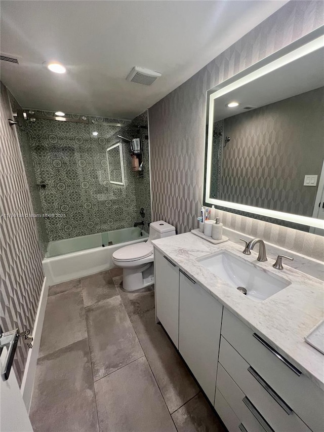 full bath featuring toilet, tub / shower combination, and vanity