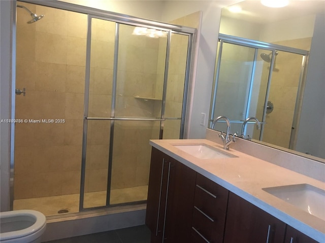 1111 SW 1st Ave Unit 2223-N, Miami, FL 33130 - bathroom featuring a shower stall, double vanity, toilet, and tile patterned flooring