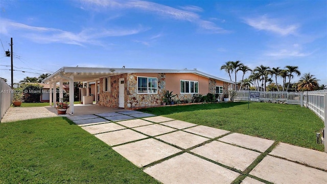5010 SW 111th Ave, Miami, FL 33165 - back of property with stone siding, a carport, and concrete driveway