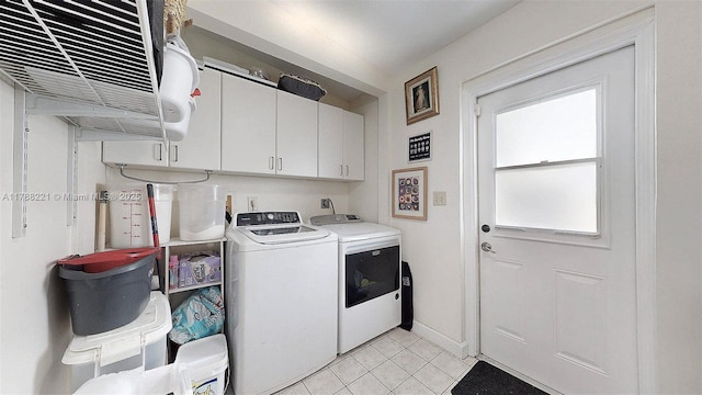 5010 SW 111th Ave, Miami, FL 33165 - laundry area featuring washing machine and dryer, cabinet space, light tile patterned flooring, and baseboards