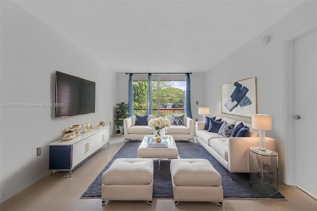 7300 NW 17th St Unit 203, Plantation, FL 33313 - living area with light tile patterned flooring and baseboards