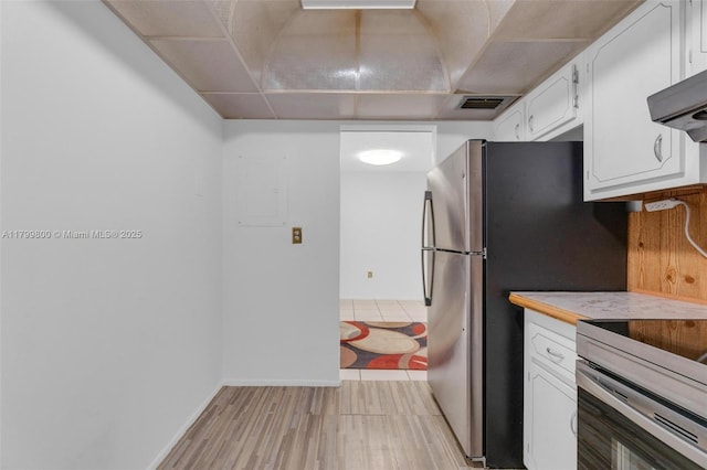 7300 NW 17th St Unit 203, Plantation, FL 33313 - kitchen with stainless steel electric range, white cabinetry, extractor fan, and light countertops