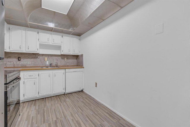 7300 NW 17th St Unit 203, Plantation, FL 33313 - kitchen with electric stove, white dishwasher, white cabinets, tasteful backsplash, and light wood finished floors