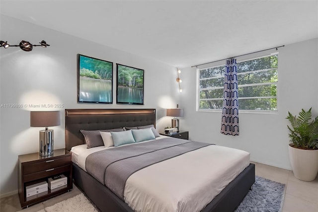 7300 NW 17th St Unit 203, Plantation, FL 33313 - bedroom with light tile patterned floors