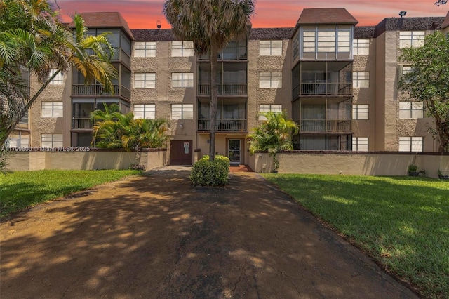7300 NW 17th St Unit 203, Plantation, FL 33313 - property at dusk with a view of apartment building / complex