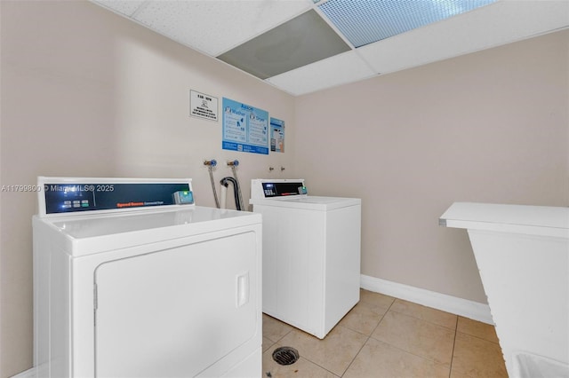 7300 NW 17th St Unit 203, Plantation, FL 33313 - communal laundry room featuring washer and clothes dryer and light tile patterned flooring