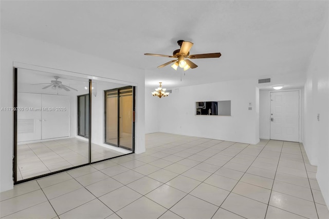 20260 NE 3rd Ct Unit 5, Miami, FL 33179 - unfurnished room featuring a ceiling fan, a chandelier, and light tile patterned flooring
