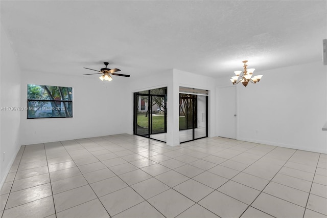 20260 NE 3rd Ct Unit 5, Miami, FL 33179 - spare room with a chandelier, light tile patterned flooring, and ceiling fan