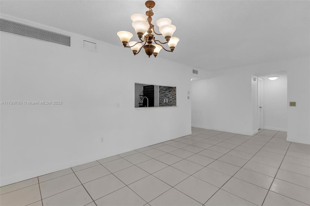 20260 NE 3rd Ct Unit 5, Miami, FL 33179 - empty room featuring a chandelier and light tile patterned floors