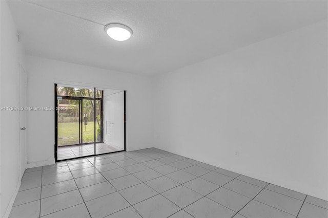 20260 NE 3rd Ct Unit 5, Miami, FL 33179 - spare room with light tile patterned floors
