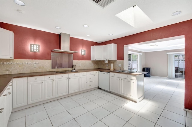 2730 NW 105th Ter, Coral Springs, FL 33065 - kitchen with wall chimney range hood, a sink, white dishwasher, a skylight, and a peninsula