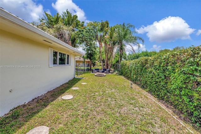 2730 NW 105th Ter, Coral Springs, FL 33065 - view of yard with an outdoor fire pit