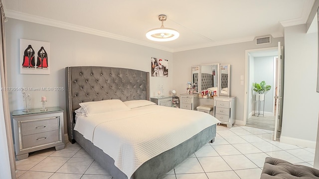 bedroom with ornamental molding, light tile patterned floors, and baseboards