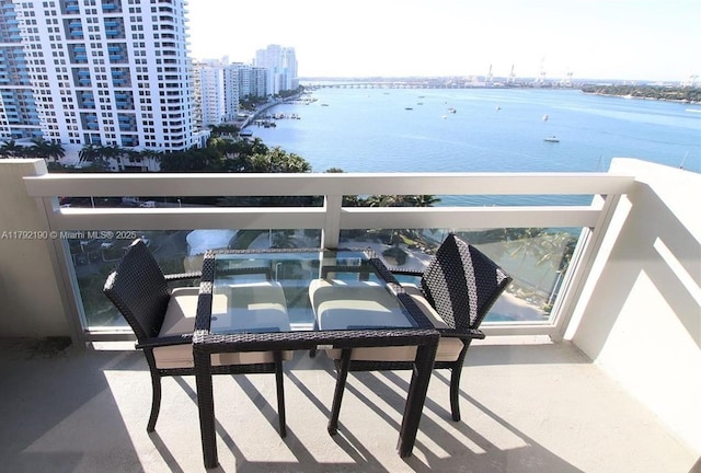 balcony featuring a water view