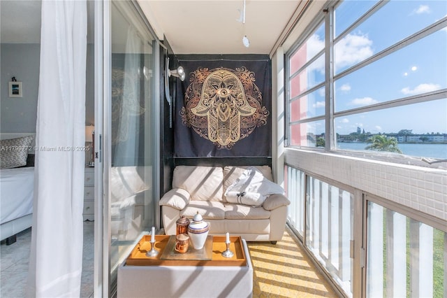 18555 NE 14th Ave Unit 612, Miami, FL 33179 - sunroom / solarium featuring a water view
