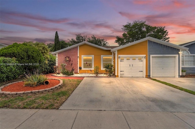 9821 W Fern Ln, Miramar, FL 33025 - view of front facade with a garage and driveway